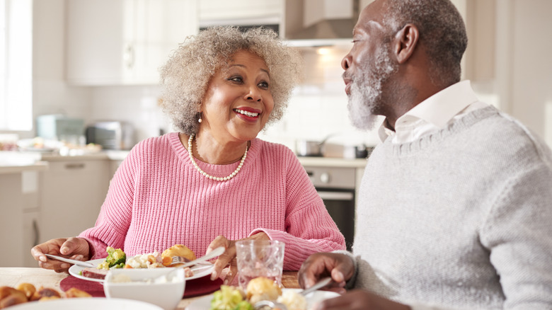 mature couple eating dinner