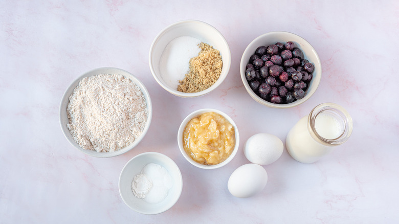 Flour, berries, apple sauce, eggs and milk for low fat blueberry muffins