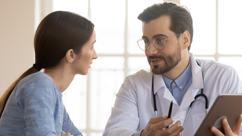 patient consulting with doctor