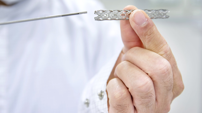 doctor holding a stent