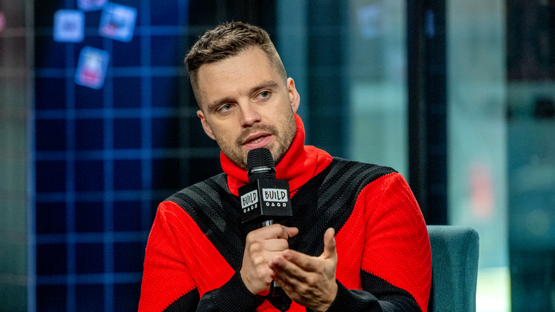 Sebastian Stan speaking at a press event for Destroyer