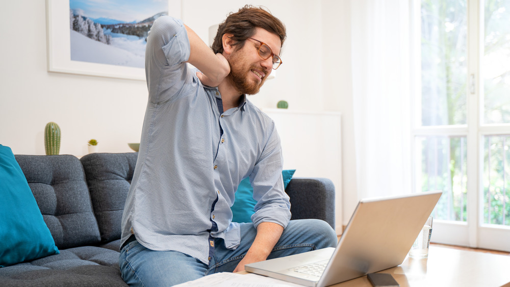 man sitting on sofa