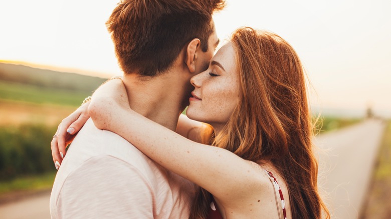 young couple in close embrace