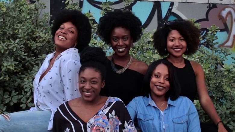 Group of Black women outside, all smiling