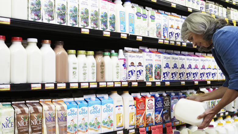 elderly woman in milk aisle