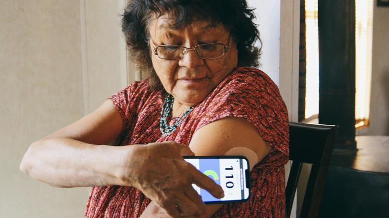 Woman checking blood sugar