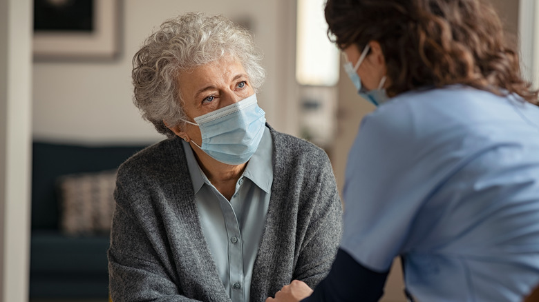 woman wearing surgical mask