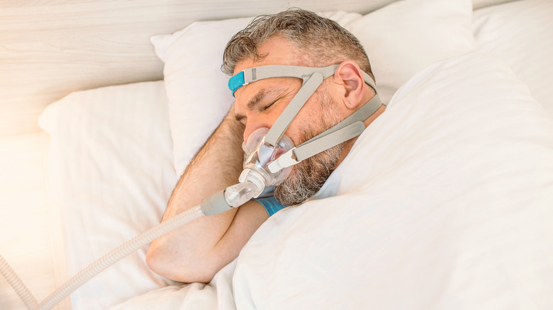 man wearing cpap