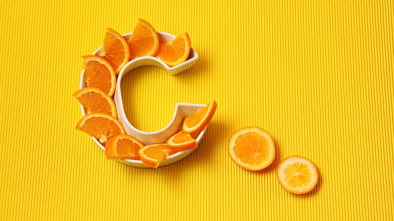 C dish filled with orange slices symbolizing Vitamin C