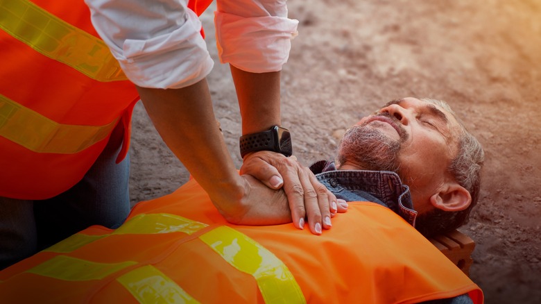 man with cardiac arrest receiving CPR