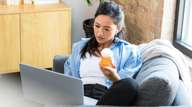 Woman researching medication on internet