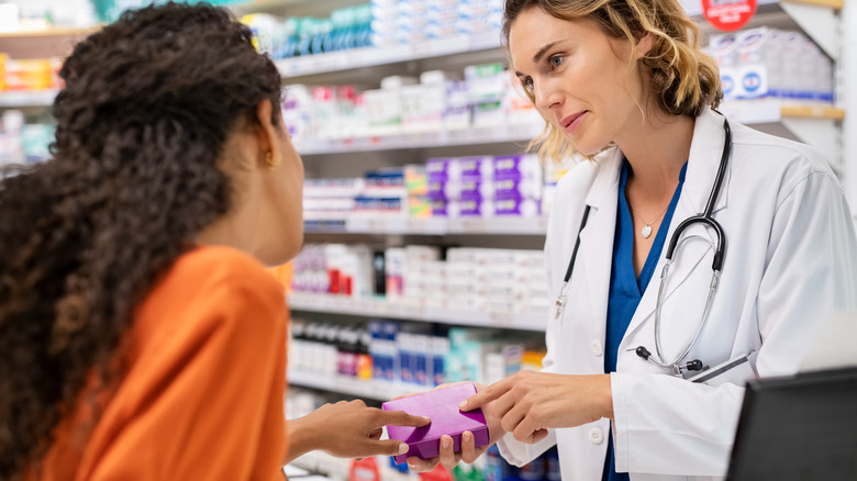 woman talking to pharmacist