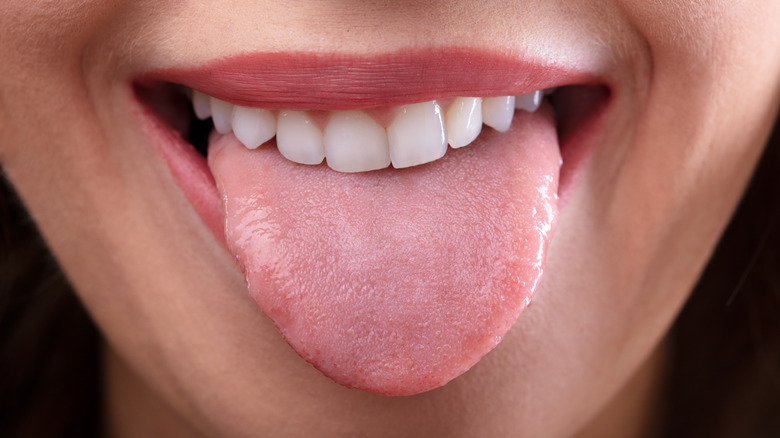 Close-up of a woman sticking out her tongue