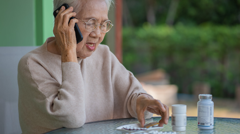 Woman on the phone asking about her medication