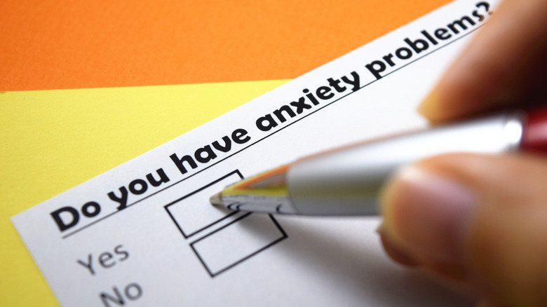 Close up of person checking a yes/no box on an anxiety questionnaire