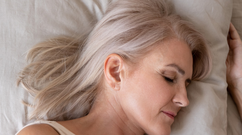 woman sleeping peacefully in bed