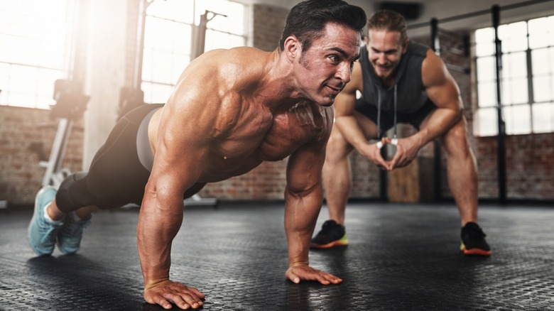 two men working out in a gym