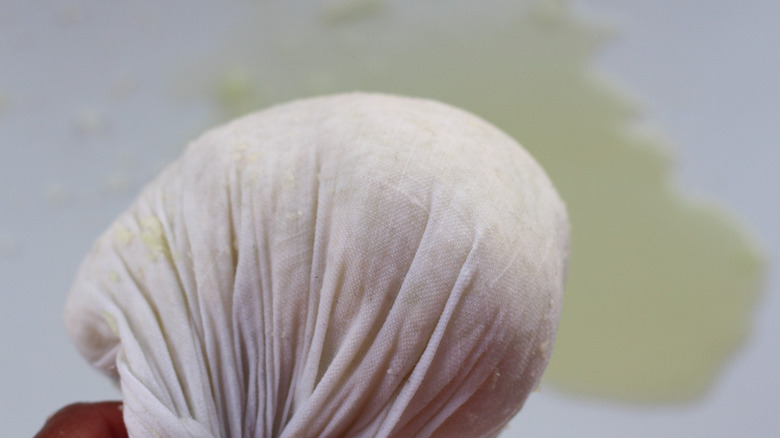 riced cauliflower in cheesecloth