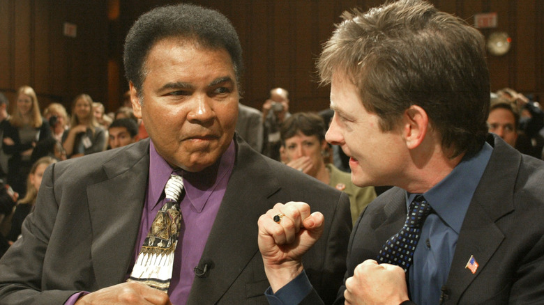 Muhammed Ali and Michael J. Fox pretending to spar before a Senate Committee hearing in 2002