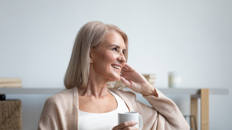 happy and peaceful woman drinking tea