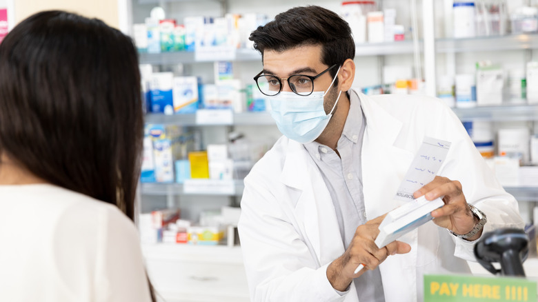 pharmacist consulting with customer