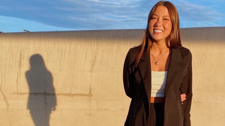 Emma Broyles smiling in parking garage