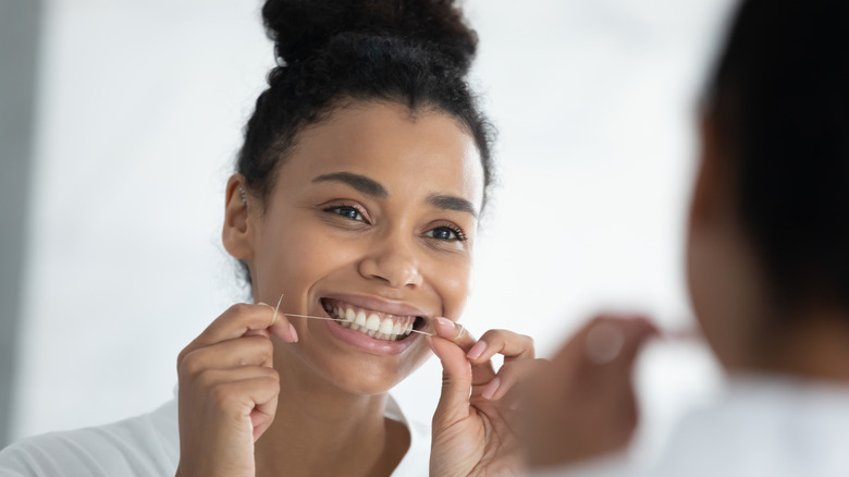 woman flossing