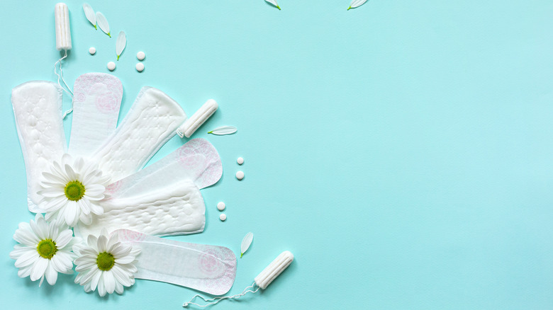 assortment of feminine hygiene products with flowers