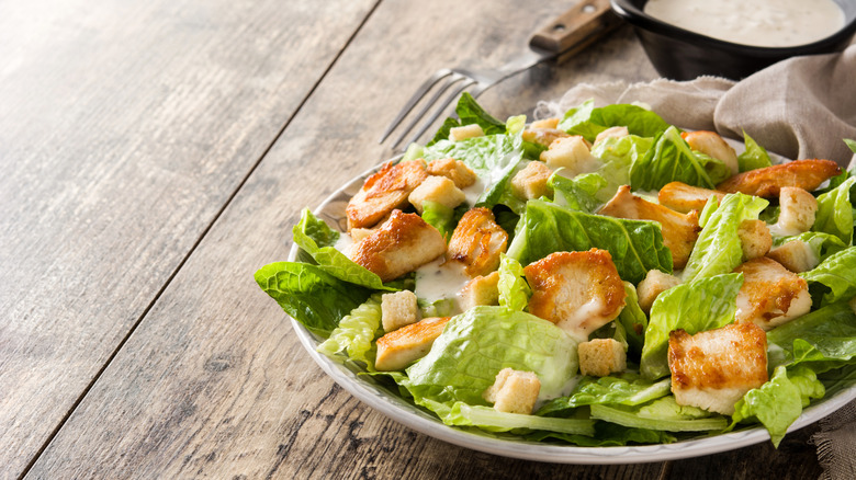 Salad with creamy dressing, chicken, and croutons