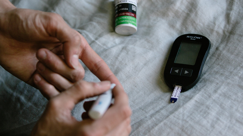 person checking blood sugar