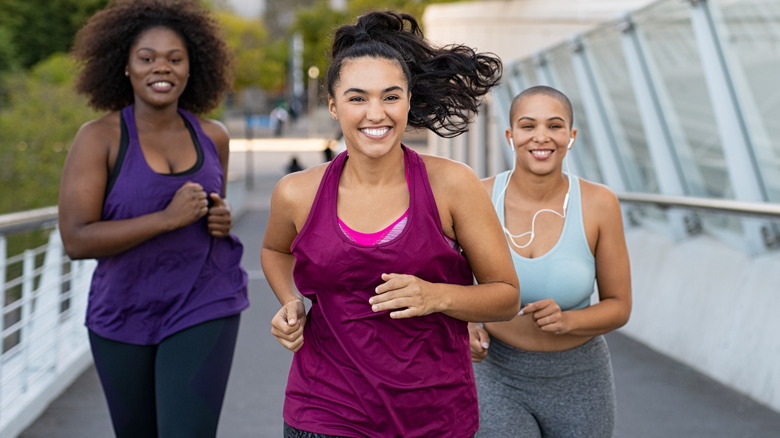 women friends running together
