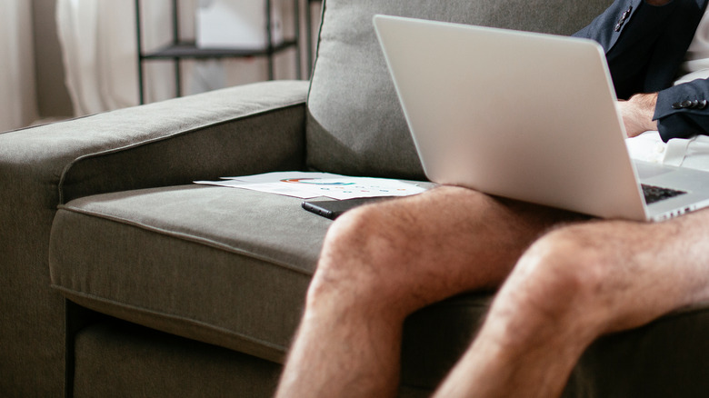 commando man with laptop covering his lap