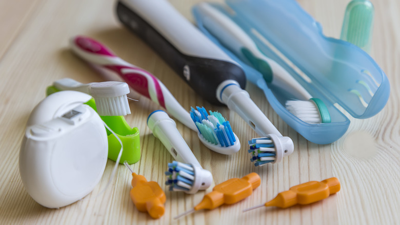 toothbrush and floss on countertop