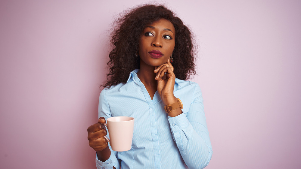 pensive woman with mug