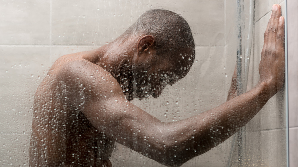 tired man in shower