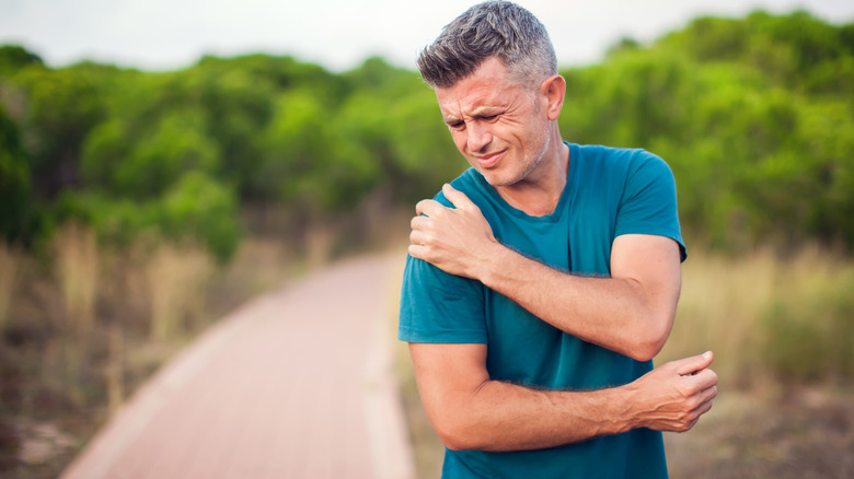 man in pain from sore shoulder