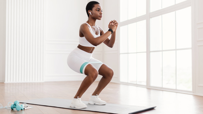 Woman using resistance band