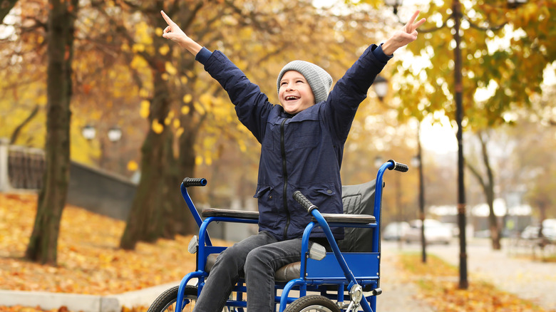 boy in wheelchair outdoors