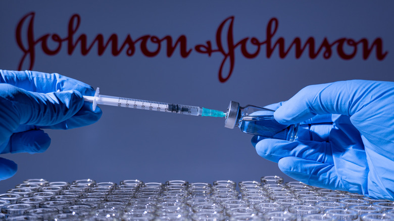 Johnson & Johnson vaccine with blue gloves