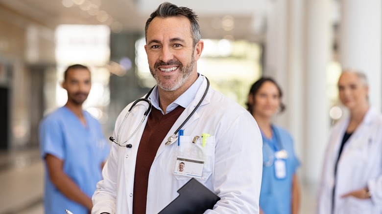 smiling doctor in white coat