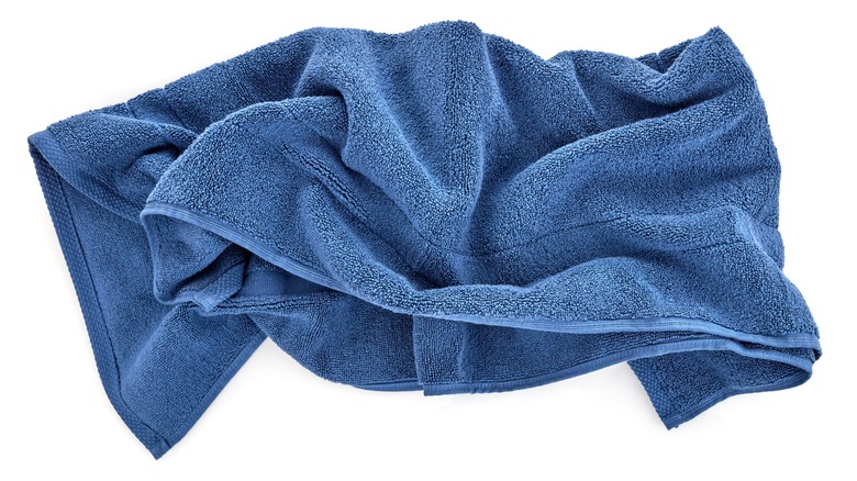 Blue towel against a white background