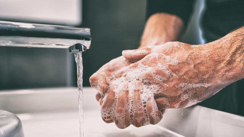 Close up of someone washing their hands