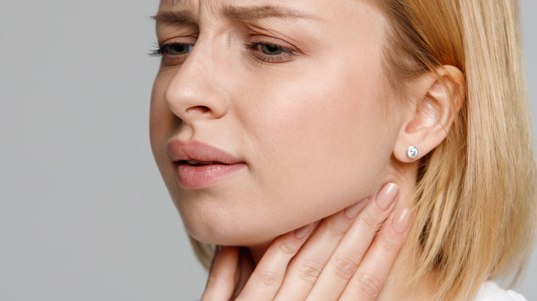 woman checking for swollen lymph nodes