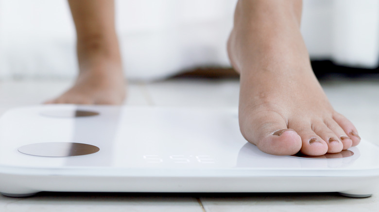 person standing on scales