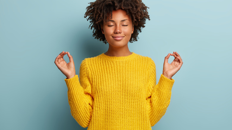 woman raising hands