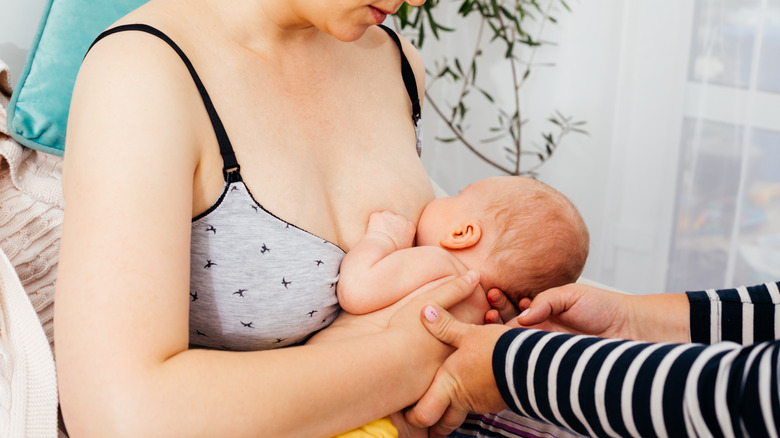 lactation consultant helping mom with latch