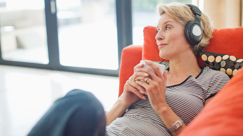 woman resting with headphones on