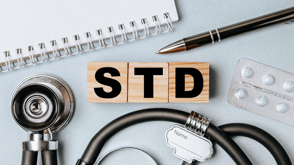 STD spelled out in block letters with medical equipment