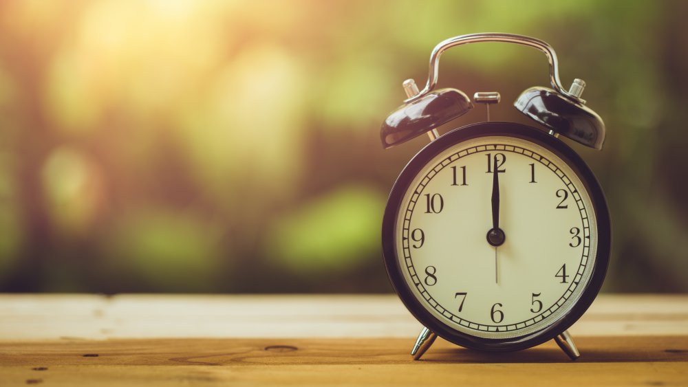 Alarm clock on a table by the window