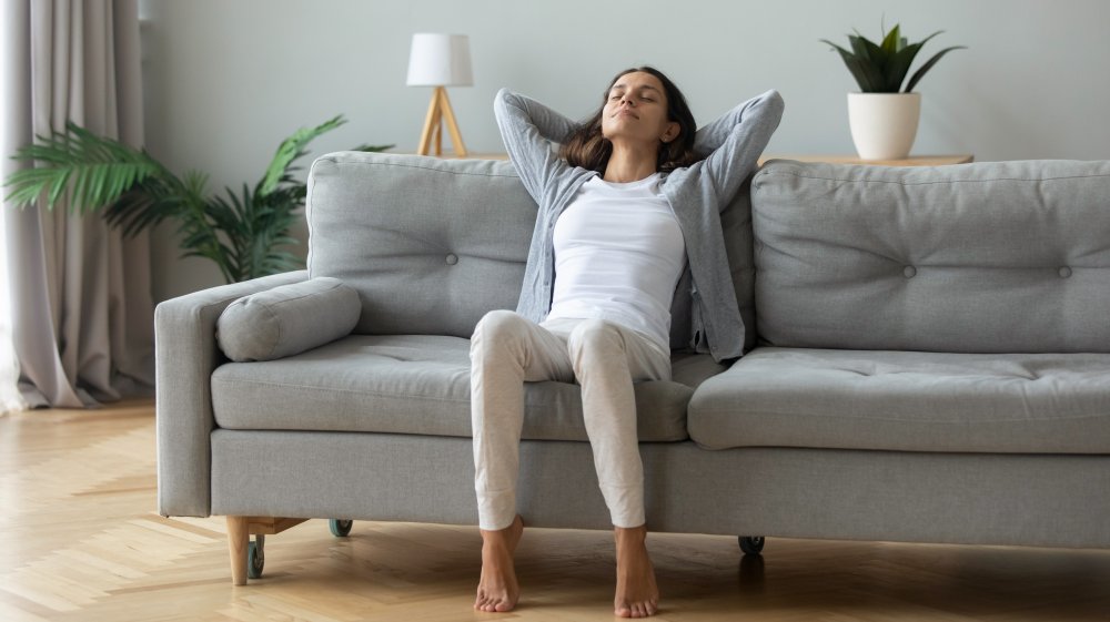 Woman stretching on a couch